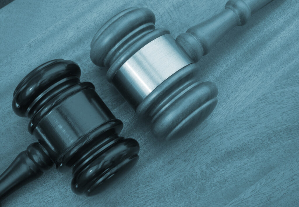 Different court decisions concept with two gavels on table