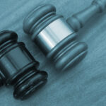 Different court decisions concept with two gavels on table